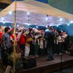 After the parade, the Oak Harbor High School Choir sang Christmas songs and danced in front of a big crowd. (Photo by Luisa Loi)