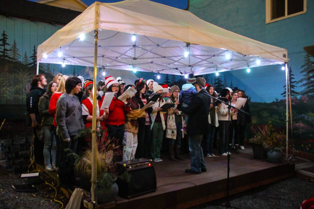 After the parade, the Oak Harbor High School Choir sang Christmas songs and danced in front of a big crowd. (Photo by Luisa Loi)