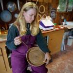 Besides stained glass pieces, Bennett also weaves baskets from pine needles. (Photo by David Welton)