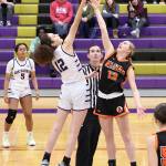 Oak Harbor High School senior AJ White tips the ball during the Wildcats first home game of the season Dec. 9. Oak Harbor won 54-51. (Photo by John Fisken)