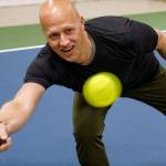 Paul Tschetter has his eye on the pickleball. (Photo by David Welton)