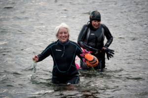 Photo by David Welton
Sharon Emerson and Kate Poss exit from their morning swim at the Langley marina