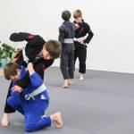 A young athlete throws his opponent to the ground. (Photo by Luisa Loi)