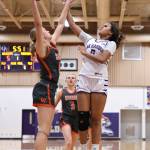 Oak Harbor sophomore Zoe Scott battles for the ball against a player from Washougal Dec. 29 where the Wildcats won 38-32. (Photo by John Fisken)