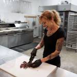 Lila chops toppings for the pizzas. (Photo by David Welton)