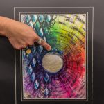 Scribner points at the ant in her art piece, titled Happy Traveler. (Photo by Luisa Loi)