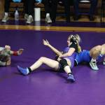 Oak Harbor senior Danielle Kanterman tries to pin her opponent during the Northwest Conference dual meet held Jan. 25 at Oak Harbor High School. She eventually won her match and the Wildcats captured the conference championship. (Photo by John Fisken)