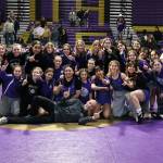 Oak Harbor High Schools girls wrestling team celebrates winning the Northwest Conference championship Jan. 25. They are preparing to compete in the subregional tournament held this weekend at Oak Harbor High School. (Photo by John Fisken)