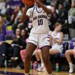 Caption – Oak Harbor’s Suki Warden takes a shot during a game against Burlington-Edison. The Wildcats are hosting a playoff game Thursday against Stanwood. Game time is 7 p.m. Photo by John Fisken.