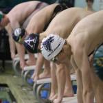 Sophomore Rowan Jung on the starting block at the beginning of his race.	(Photo by Matt Simms)