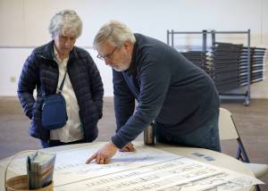 Photo by David Welton
Councilmember Craig Cyr studies the plans for workforce housing on the Whidbey Island Fairgrounds.