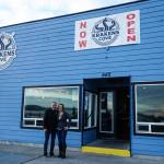 Co-owners Kevin (left) and Megan Collins (right) pose in front of Kraken's Cove in Oak Harbor. (Photo by Sam Fletcher)