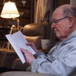 Oak Harbor resident Carl Smith reads at a Kabbalah study session. (Photo by Sam Fletcher)