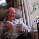 Oak Harbor resident Carl Smith reads at a Kabbalah study session. (Photo by Sam Fletcher)