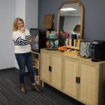 McCullough grabs a snack from the pantry at the Collective. (Photo by Luisa Loi)