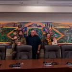 From left to right: George Mann, artist Nick Mann, Mayor Ronnie Wright, artist Kendall Mann and Anastasia Mann pose before the newly-installed Song of the Salish Sea in council chambers. (Photo by Sam Fletcher)