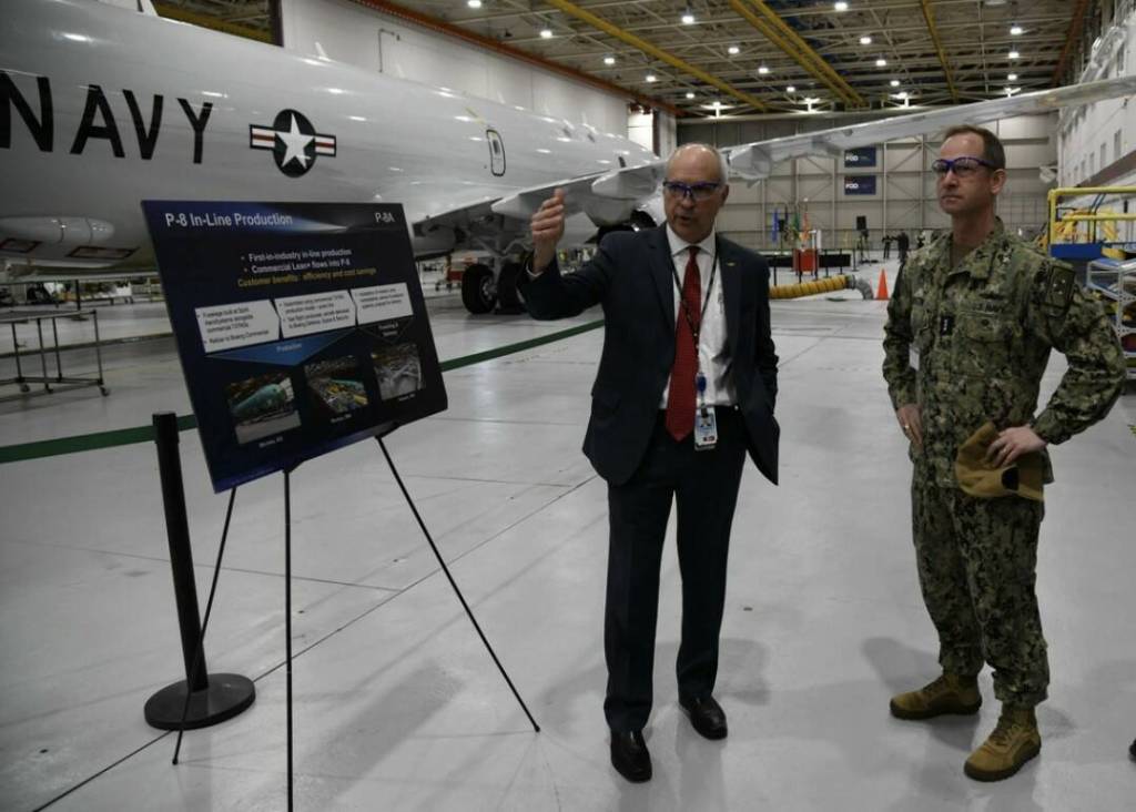 Vice Adm. John B. Mustin, Chief of Navy Reserve and Commander, Navy Reserve Force, receives a tour from Perry Yaw, Business Development Lead for Boeing P8 Program, before taking delivery of the first new P-8A Poseidon for the Naval Air Force Reserve during a ceremony at Boeing Military Delivery Facility in Tukwila, Washington, March 6, 2024. This first delivery of the new P-8A Poseidon is a historic moment as it is the first purpose-built aircraft sent directly to the Navy Reserves defense architecture in its aggressive transformation as an elite warfighting organization. Our patrol aircraft deploy and operate globally in support of national defense priorities executing myriad missions ranging from supporting homeland defense (HLD), participating in exercises sustaining fleet readiness, and work alongside partner and allied nations maintaining proficiency and increasing interoperability. (Photo courtesy of the US Naval Air Force Reserve)