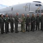 Cmdr. James Tilden, Commanding Officer of Patrol Squadron 62, presents a dedication plaque to Vice Adm. John B. Mustin, Chief of Navy Reserve and Commander, Navy Reserve Force, after taking delivery of the first new P-8A Poseidon for the Naval Air Force Reserve during a ceremony at Boeing Military Delivery Facility in Tukwila, Washington, March 6, 2024. This first delivery of the new P-8A Poseidon is a historic moment as it is the first purpose-built aircraft sent directly to the Navy Reserves defense architecture in its aggressive transformation as an elite warfighting organization. Our patrol aircraft deploy and operate globally in support of national defense priorities executing myriad missions ranging from supporting homeland defense (HLD), participating in exercises sustaining fleet readiness, and work alongside partner and allied nations maintaining proficiency and increasing interoperability. (Photo courtesy of the US Naval Air Force Reserve)