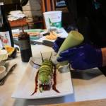 Photo by Sam Fletcher
Sushi chef Claude Johnston prepares the caterpillar roll in Off the Hook.