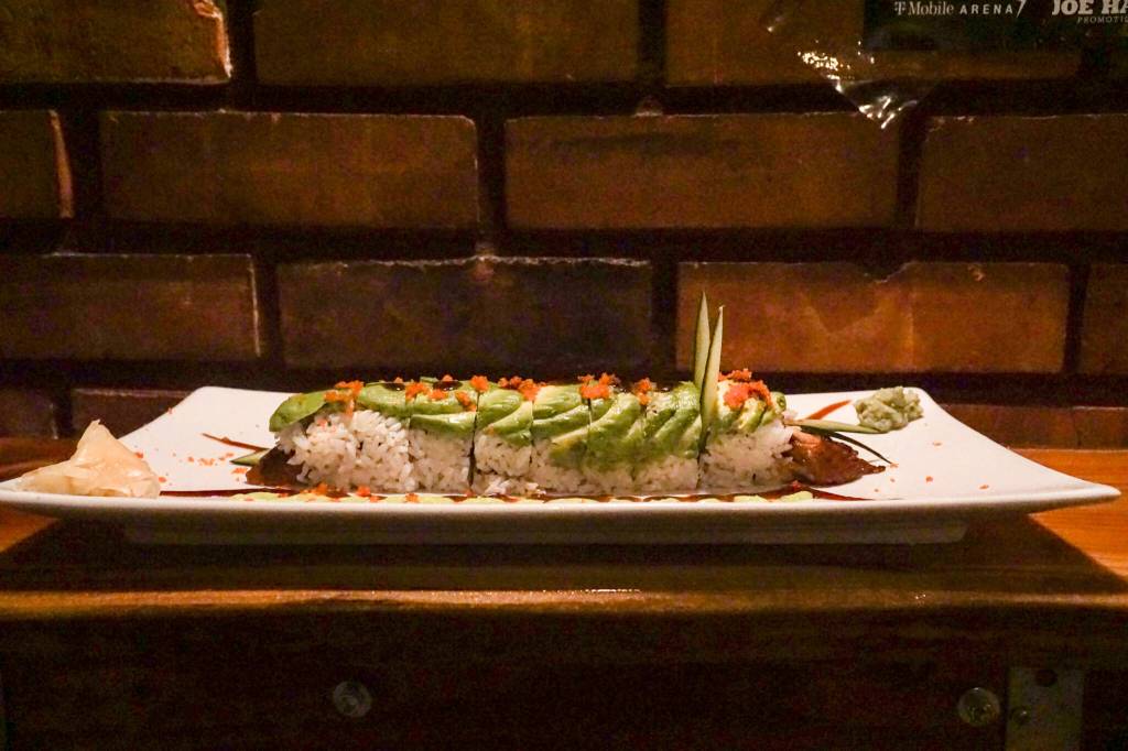 The caterpillar roll is part broiled eel sushi, part sculpture, with cucumber-sliver antennae, an avocado exoskeleton, tobiko or fish egg eyes and unagi sauce legs. (Photo by Sam Fletcher)