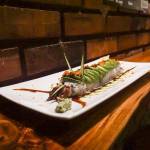 The caterpillar roll is part broiled eel sushi, part sculpture, with cucumber-sliver antennae, an avocado exoskeleton, tobiko or fish egg eyes and unagi sauce legs. (Photo by Sam Fletcher)