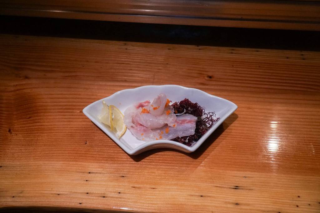 Photo by Sam Fletcher<em></em>
Sushi chef Claude Johnston serves yellowfin tuna at Off the Hook.
Sushi chef Claude Johnston serves yellowfin tuna at Off the Hook. (Photo by Sam Fletcher)