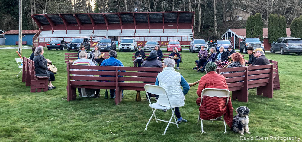Around 50 people from a few months old to seniors encircled a propane firepit by a beautiful historic barn of the Whidbey Island Fairgrounds. (Photo courtesy of David Stern)