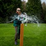 Jeremy Coleman of the Snohomish Dueling Society slashes a water bottle with his sword. (Photo by David Welton)