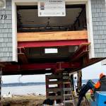 Reddan Construction workers build cribs, wooden towers, which come underneath a Whidbey Shores property. (Photo courtesy of Reddan Construction)