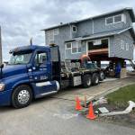 A truck brings in helical anchors to a Whidbey Shores property to pin the new foundation. (Photo courtesy of Reddan Construction)