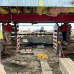 Reddan Construction workers build cribs, wooden towers, which come underneath a Whidbey Shores property. (Photo courtesy of Reddan Construction)