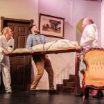 Photo by Luisa Loi
Eric Swan (played by Wesley Moran) attempts to stop the undertaker (Steve De Haven) and grief counselor (Amy Jones) from taking away a body.