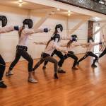 Fencing partners Bob Tearse and Joseph Kleinman are teaching the discipline of foil fencing. When using the foil blade, fencers score points by touching their opponents torso with the tip of the weapon, which makes the blade bend. (Photo by Luisa Loi)
