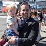 Shane Hoffmire hold his son.