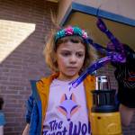 Third grader Irene Doleshel watches her painted water bottle transform with the help of a heat gun. (Photo by David Welton)