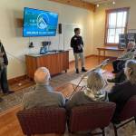 Ian Joseph Jackson, left, and Ben Silesky present Solarize Island County to South Whidbey residents at an informational session on Tuesday. (Photo provided)