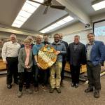From left to right: Parks and Rec Director Brian Smith, Councilmember Barbara Armes, Councilmember Christopher Wiegenstein, Parks employee Bill Leuthe, Councilmember Bryan Stucky, Parks Supervisor Brandon Cable, Councilmember Eric Marshall, Mayor Ronnie Wright and Councilmember Shane Hoffmire present a plaque honoring the citys 21st Tree City USA Designation at a city council meeting on Tuesday. (Photo provided)