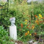 The Gillespies garden became an Italian style oasis, with cypress trees, a picket fence and arched gates. (Photo by Sam Fletcher)