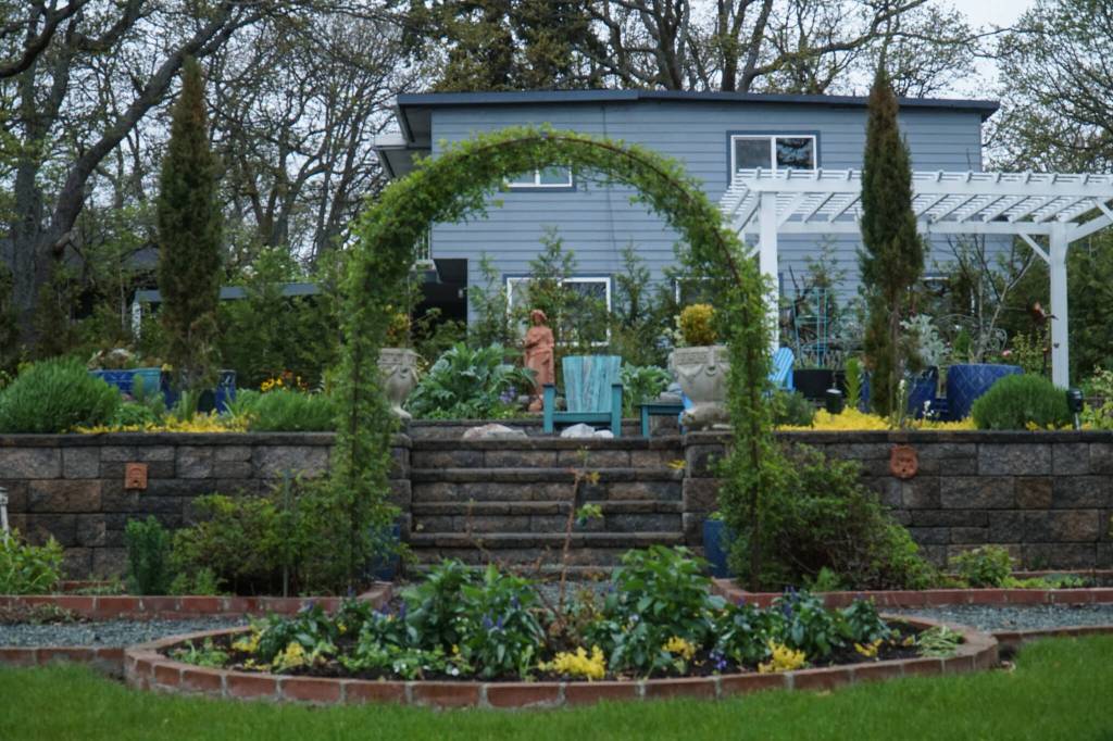 Oak Harbor resident Gary Gillespie put in paths to naturally lead people through with terraces and a pergola encouraging them to linger and enjoy the ocean view. (Photo by Sam Fletcher)