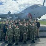 The Orion Squadron poses before a prowler on a VAQ-129 tour in 2022. (Photo provided)