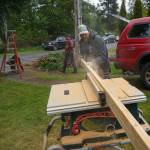 Photo by David Welton
A Hearts & Hammers volunteer cuts wood to repair a deck on Saturday.