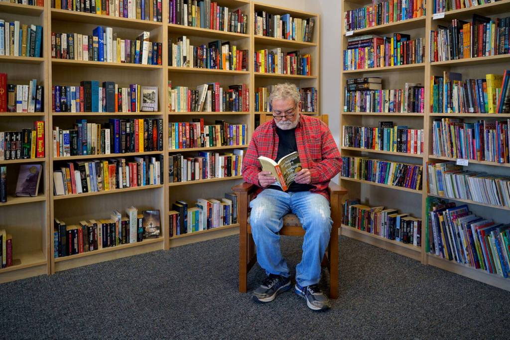 Photo by David Welton
Bob Markey reads from Barbarian Days: A Surfing Life by William Finnegan. Its one of many titles within his new bookstore, Mutiny Bay Books.