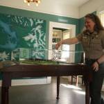 Photo by Sam Fletcher
Interpretive specialist Jen Gray interacts with a Fort Casey map in the new Admiralty Head Lighthouse exhibit.