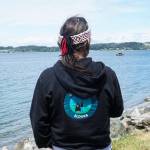 Photo by Sam Fletcher
Tony Cladusbid, co-owner of the Beaver Tales Coffee franchise, watches over the canoe racing at the Penn Cove Water Festival on Saturday.