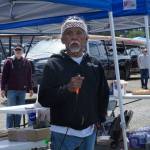 Tony Cladusbid, co-owner of the Beaver Tales Coffee franchise, announces the canoe races at the Penn Cove Water Festival on Saturday. (Photo by Sam Fletcher)