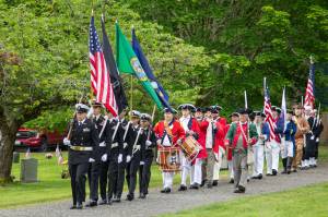 CPO William Thiel, US Navy (Ret) Oak Harbor High School NJROTC Color Guard, Joined by Sones of the American Revolution, George Washington Chapter and USN Sea Cadets Corps, ORION Squadron present the colors at the Memorial Day Service of Remembrance at the Maple Leaf Cemetary, May 27 (photo by Caitlyn Andrson)