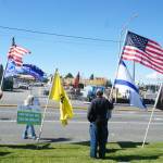 Ralliers held flags for the United States, Israel, the military, Trump and Bird on Thursday. (Photo by Sam Fletcher)