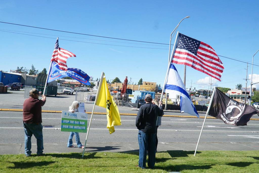Ralliers held flags for the United States, Israel, the military, Trump and Bird on Thursday. (Photo by Sam Fletcher)