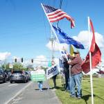 Island County Republican Party President Tim Hazelo (right) rallies with others in Oak Harbor on Thursday. (Photo by Sam Fletcher)
Island County Republican Party President Tim Hazelo (right) rallies with others in Oak Harbor on Thursday. (Photo by Sam Fletcher)