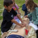 Photo by Caitlyn Anderson
Leo Hernandez practices CPR on an ambulance dummy at the Touch-a-Truck event.